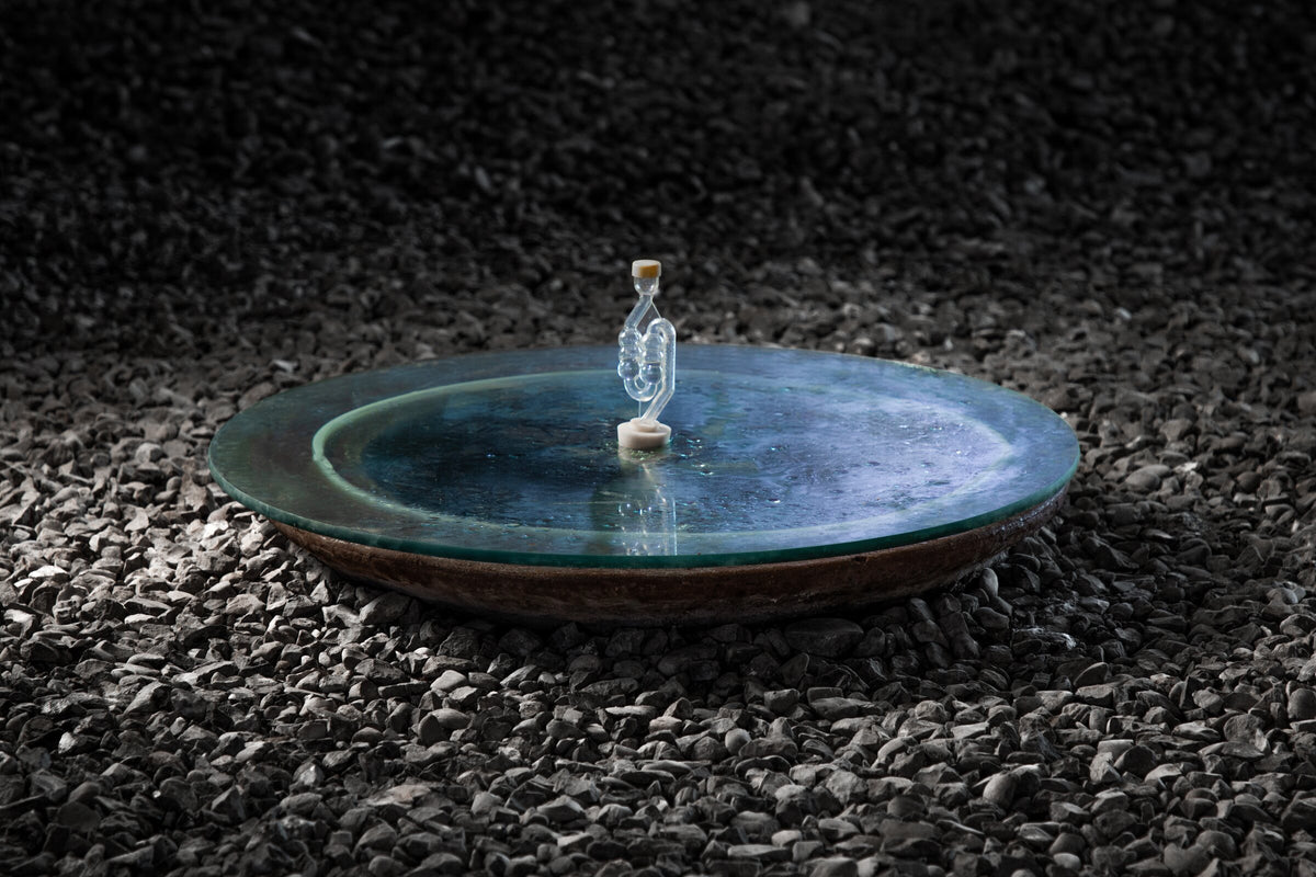 A qvevri set into the gravel floor of the marani at Periani